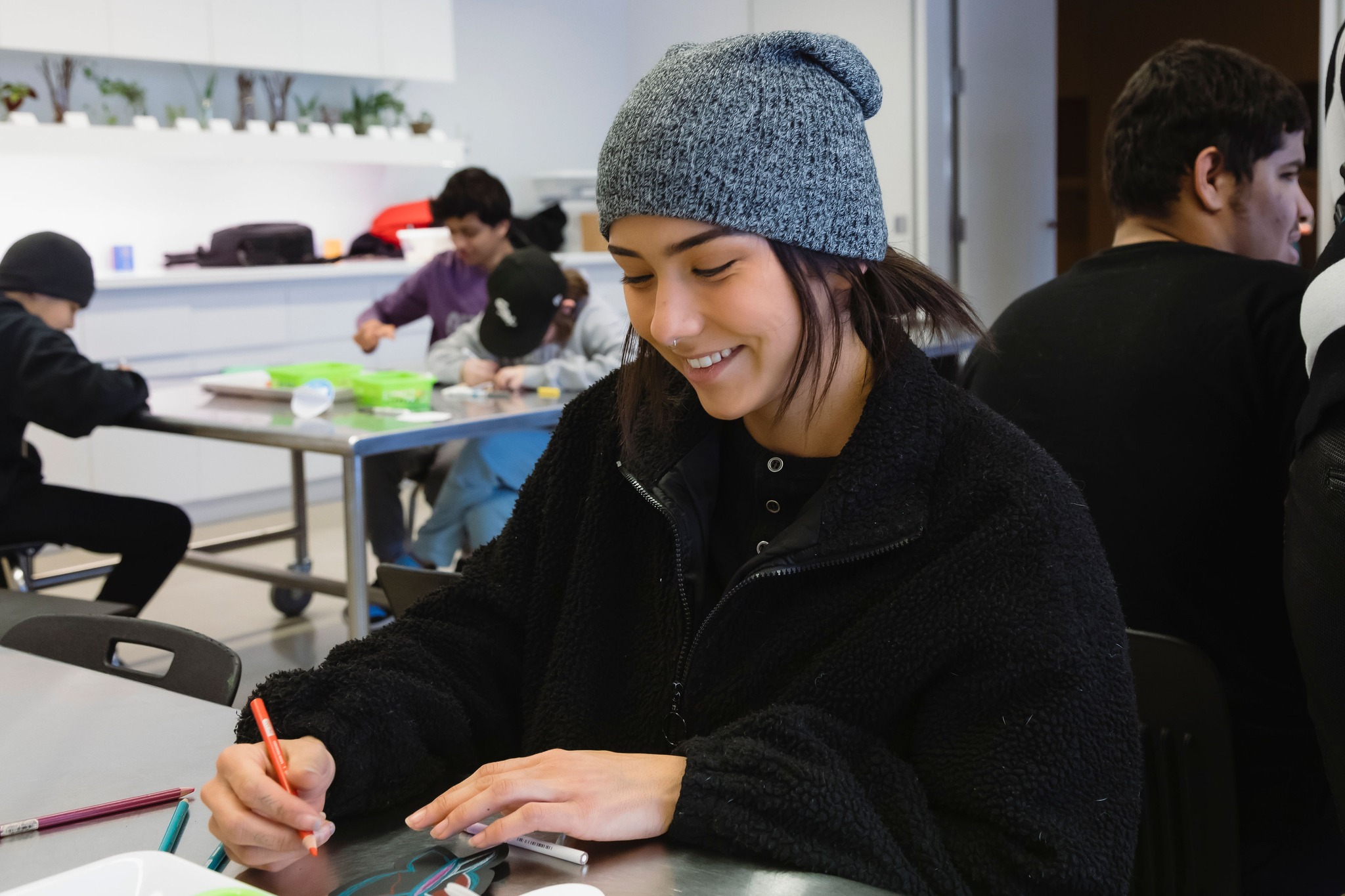 Photo of a young artist in the learning studio working on a drawing