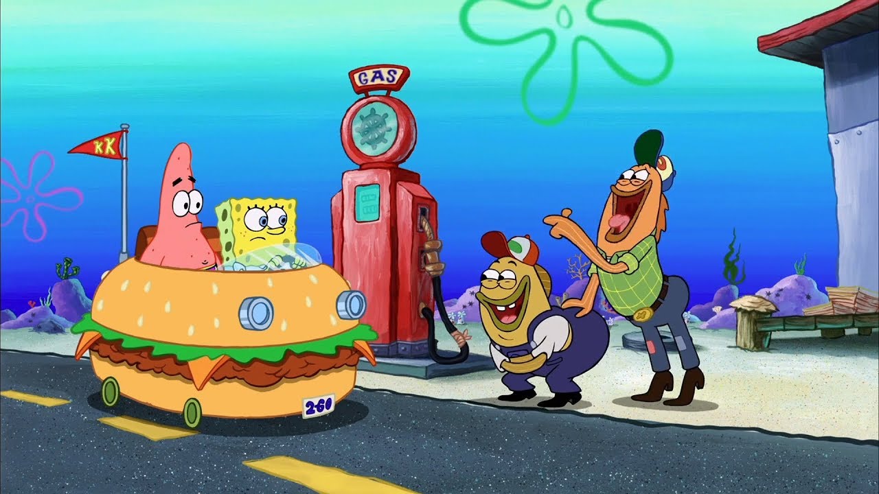SpongeBob SquarePants and Patrick Star are sitting in a car shaped like a hamburger. SpongeBob, in the driver’s seat, looks worried while Patrick, in the passenger seat, has a surprised expression. They are parked at a red gas pump labeled “GAS,” with a hose hanging nearby. Two fish characters, dressed like mechanics, stand beside the pump. One is wearing overalls and a cap, while the other is in a green plaid shirt and jeans. Both mechanics are laughing and pointing at SpongeBob and Patrick. The background features an underwater environment with various oceanic elements like rocks, plants, and a blue sky with seaweed.
