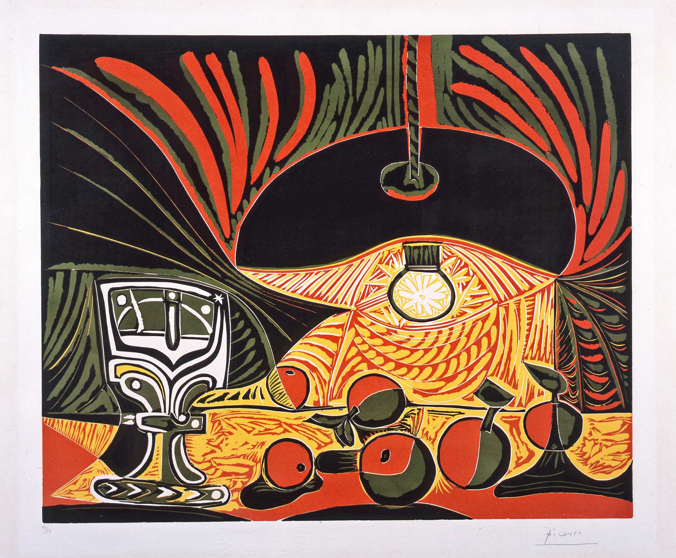 A vibrant Picasso linocut print depicting a still life scene with a hanging lamp, decorative goblet, and fruits set against bold sweeping foliage, rendered in striking black, red, olive green, and golden yellow.